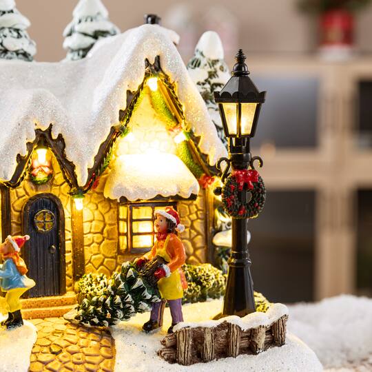 Glitzhome® 9.5" Lighted Christmas Snowy Musical Resin Village with Movement and Timer
